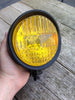 Koplamp zwart met gele lens 5.5 inch
