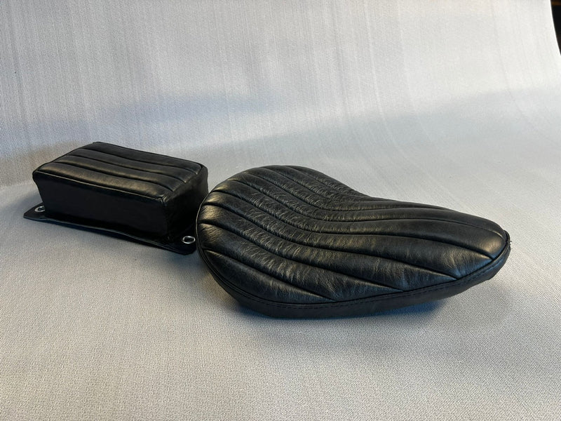 The Miller Bates style replica solo seat vintage black tuck n roll